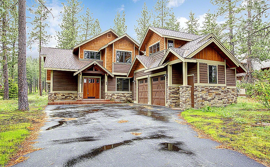 16662815 – mountain luxury home with stone and wood exterior, spring forest.