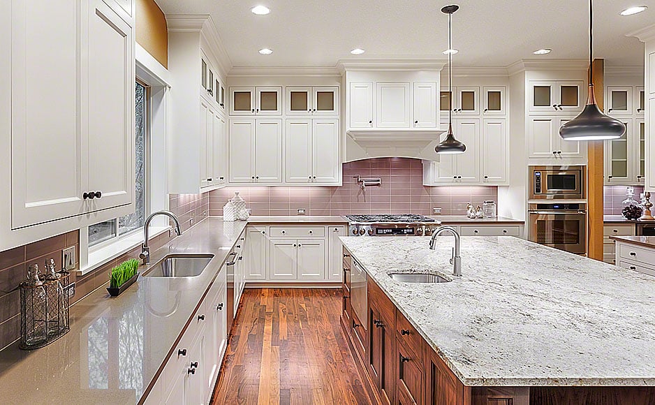 Beautiful Kitchen in New Luxury Home, with wrap around cabinetry
